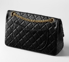 На идею создания стеганой поверхности сумки Шанель вдохновили витражи аббатства Обазин (Aubazine), где она провела детство и юность, а также куртки жокеев, как известно, мадемуазель обожала скачки. Цепочка, послужившая ручкой новой модели сумки также родом из Обазина - монахини, жившие в аббатстве, носили на цепях ключи. Сначала сумки закрывались на, так званый, «замок мадемуазель», но в 1980-х появилась новая версия, закрывающаяся на замок в виде логотипа Chanel – две пересекающиеся литеры «С», смотрящие в противоположных направлениях. Такой замок называется «Classic Flaps».